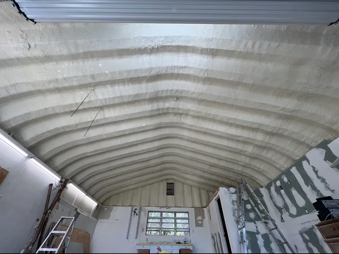 Spray polyurethane foam applied to the underside of a metal roof deck in Alamosa